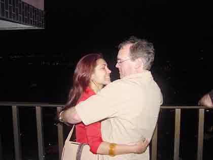 An old man with a younger Latina