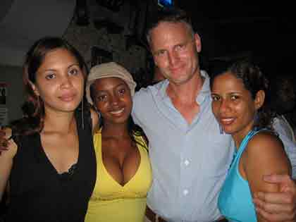 A man with three beautiful Latin women